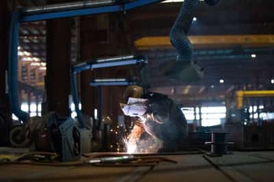 Image for China's factory activity snaps record slump on festive stockpiling