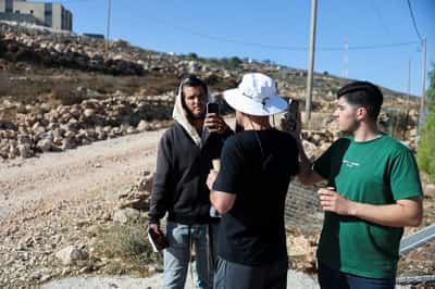 Image for Exclusive-Israeli settler confronts Palestinian American at his besieged West Bank home