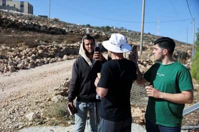 Image for Exclusive-Israeli settler confronts Palestinian American at his besieged West Bank home