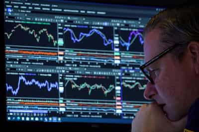 Image for US stocks end lower, Treasury yields slide amid revived valuation concerns, Fed uncertainty