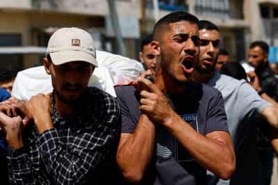 Image for Palestinians mourn slain Hamas militant chief as Israel escalates Gaza attacks