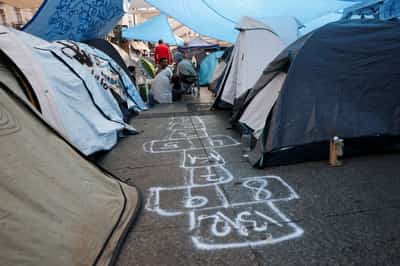 Image for Protesters camped out across Spain demand passage of housing measures