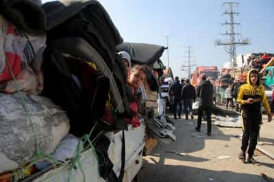 Image for Gaza residents stream home to the north after hostage breakthrough