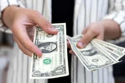 Image for Dollar set for weekly rise as Swiss cut signals potential rates gap