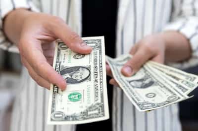 Image for Dollar set for weekly rise as Swiss cut signals potential rates gap