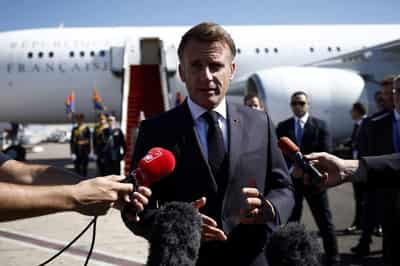Image for France's Macron won't resign, as no-confidence votes threaten his new government