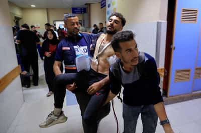 Image for Gaza ministry says Israel kills more than 30 aid seekers, Israel denies