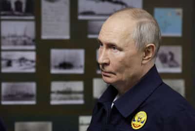 Image for Russia's Putin visits disputed Kuril Islands, samples fish roe, media say