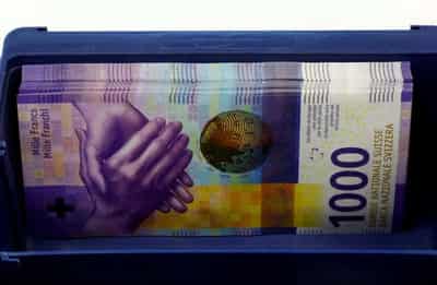 Image for Swiss franc in biggest daily jump since 2015 after rate hike