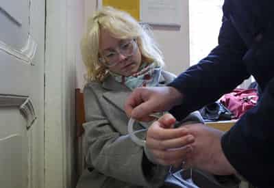 Image for Russian street musician is jailed for 13 days after she played banned song