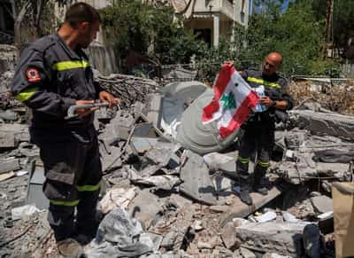 Image for In Lebanon, first responders salvage memories from debris of destroyed HQ