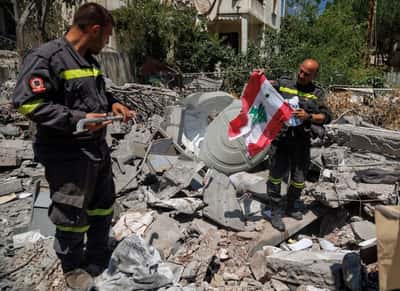 Image for In Lebanon, first responders salvage memories from debris of destroyed HQ