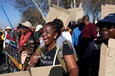Image for South African anti-migrant protests turn violent, with cars torched, gunshots fired