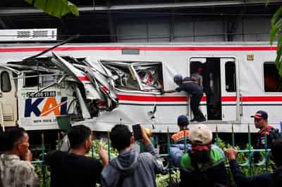 Image for Indonesia commuter train crash toll rises to 14 as rescuers complete evacuation