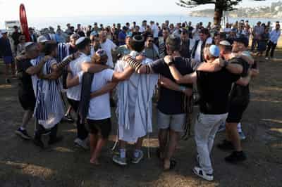 Image for Australia plans gun buyback after Bondi massacre, as surfers honour victims