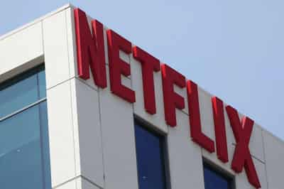 Image for Netflix forecasts an end to borrowing binge, shares surge