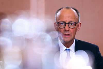 Image for Germany's Merz calls on EU allies to boost defence spending on first foreign visit