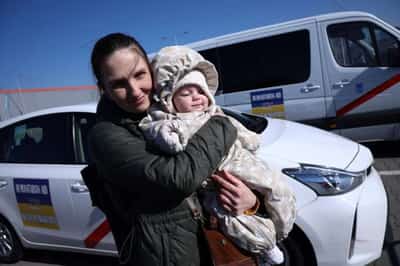 Image for A long road and new life ahead for Ukrainians fleeing war by taxi