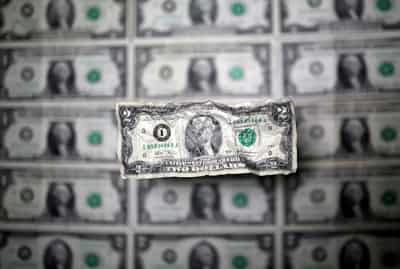 Image for Dollar edges lower, traders focus on data for Fed clues