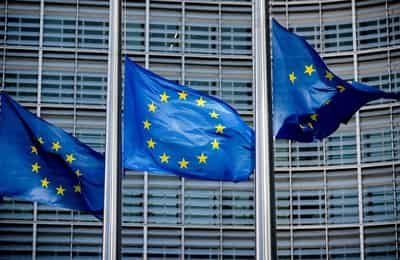 Image for EU Commission sees euro zone economy picking up, warns of US protectionism
