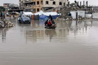 Image for Gazans struggle to retrieve bodies as storms lash war-damaged buildings