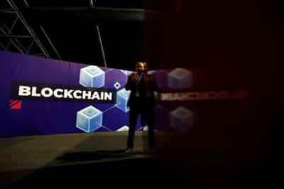 Image for Analysis: Blockchain needs MP3 music moment to win over markets