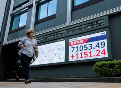 Image for Stocks set records in Japan, South Korea; dollar gets Fed boost