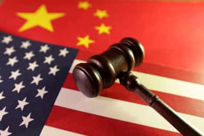 Image for Factbox-China imposes new curbs on U.S. firms as trade row grows