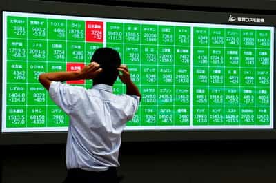 Image for Dollar strong ahead of Fed meeting, Japan auto shares surge on Honda-Nissan news