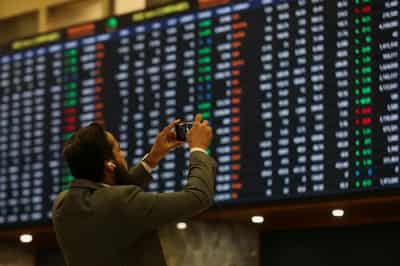 Image for Dollar stays resilient, Asia shares wobble