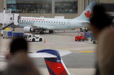 Image for Exclusive-Canada to ease travel requirements as COVID cases decline – source