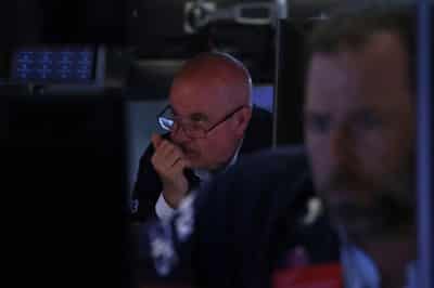 Image for US futures inch up; stock markets ride higher on cooler inflation