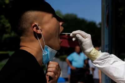 Image for Fresh COVID wave sweeps Asia, New Zealand warns of pressure on hospitals