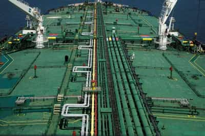 Image for Oil up 2% as dollar weakens on small US Fed rate hike