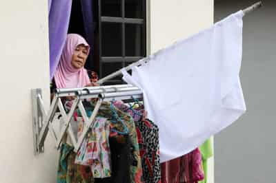 Image for As lockdown bites, Malaysians hoist white flags in plea for help