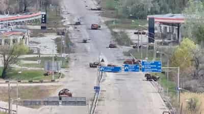 Image for People in Russian-occupied Ukrainian town risk 'road of death' to get food