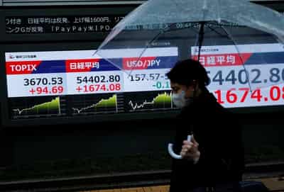 Image for Stocks slide in Asia, Brent crude heads for record monthly rise