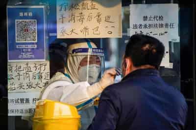 Image for Queues form at fever clinics as China wrestles with COVID surge