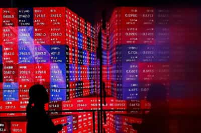 Image for Asia stocks, Wall St futures edge up; China trims repo rate