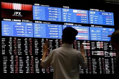 Image for Asian stocks slide after Fed flags slower rate cuts, BOJ stands pat