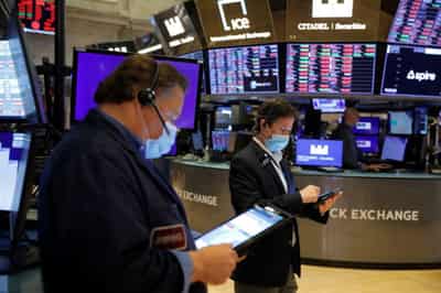Image for Shares end at new peaks, dollar slips on Delta concerns