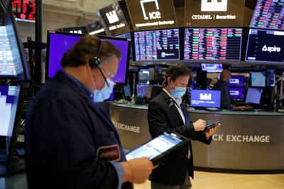 Image for Shares end at new peaks, dollar slips on Delta concerns