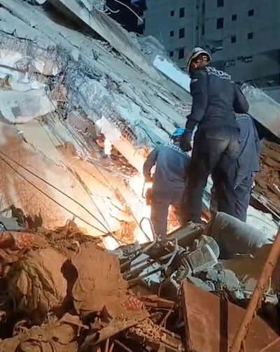 Image for Rescuers in Venezuela pluck child alive from collapsed building six days after twin quakes