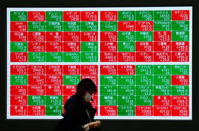 Image for Nasdaq confirms correction, dollar weakens as tariff news fuels unease