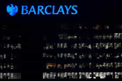 Image for Barclays resumes dividend as annual profit halves