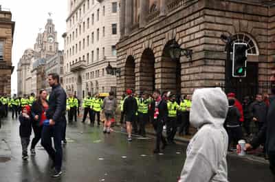 Image for Car ploughs into fans at Liverpool parade, 27 in hospital