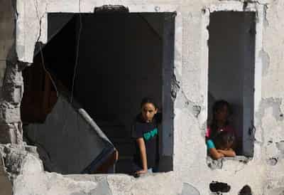Image for Race to evacuate war-damaged Gaza buildings after deadly apartment block collapse