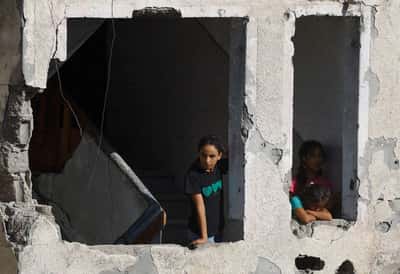 Image for Race to evacuate war-damaged Gaza buildings after deadly apartment block collapse