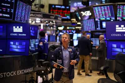 Image for Global shares and dollar higher as markets eye Fed rate cuts