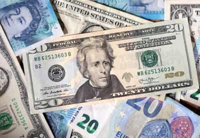 Image for Dollar weakens as US tariffs struck down, Iran tensions rise